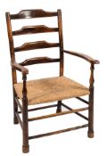 A mid 19th century ash ladder back open armchair by Philip Clissett: with four cross splats,