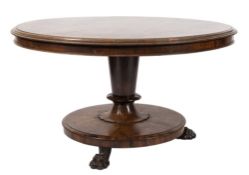 A Victorian rosewood circular loo table:, the snap top with a moulded edge,