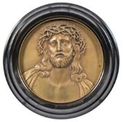 An Italian gilt brass plaque 'Ecce Homo: 12cm. diameter.