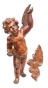 A 19th century Continental carved fruitwood cherub: with outstretched wings and left arm raised,