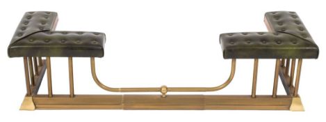 A brass club fender:, with twin upholstered button down seats in green leather,