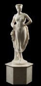 A 19th century carved white marble standing classical female figure: wearing a floral garland in