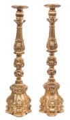 A pair of Italian carved giltwood candlesticks: in 17th century style,