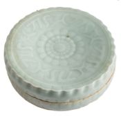 A Chinese Qingbai celadon glazed cosmetics box and cover: of circular form moulded in low relief