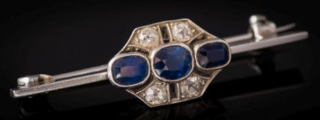 A sapphire and diamond seven-stone bar brooch: with octagonal panel of oval and cushion-shaped