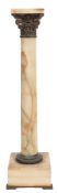 A marble torchere: with gilt metal foliate and scroll capital on a plain column with gilt metal