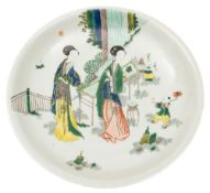 A pair of Chinese porcelain dishes: enamelled in the famille verte palette with a pair of elegant