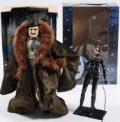 A Neca 1/4th scale Batman Returns 'Penguin' figure in box and a loose 1/6th scale 'Catwoman'