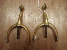 A pair of George III brass and steel spurs:,