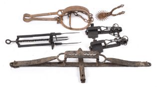 A group of five various steel and iron traps including a man trap and a mole trap:,