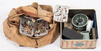 A collection of fly and spinning reels, aluminium fly tins and contents:,