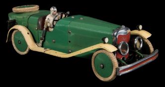A Meccano No 2 clockwork constructor car in green and cream: made up as an open boat-tailed