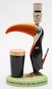 A Carlton Ware Guinness Toucan lamp:, painted in colours with advertising slogan to base,