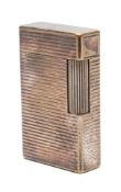 An S J Dupont silver plated lighter:, with ribbed body.