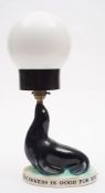 A Carlton Ware Guinness Sealion lamp with associated shade:,