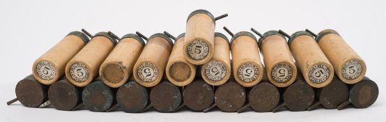 A collection of 22 12 bore pinfire cartridges:.