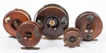 A mahogany and brass 5 inch star back reel by Sun:,