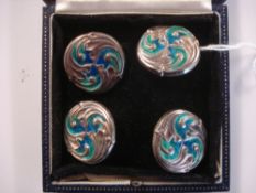 By Liberty and Co- A set of four Cymric silver and green/blue enamel circular buttons:,