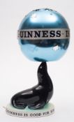 A Carlton Ware Guinness Sealion lamp with revolving shade:,