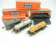 Lionel O gauge, a group of freight cars:, including Santa Fe (3464), caboose (6457),