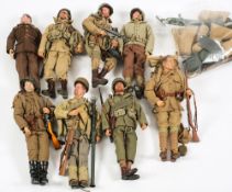 A group of eight 1/6th scale military figures in WWII uniform:,