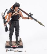 A loose Enterbay 1/4th scale Rambo III figure: with a small collection of accessories. .