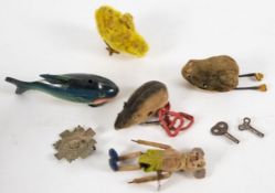 A Schuco clockwork tumbling mouse:, together with a Schuco clockwork frog and mouse,