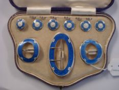 A cased set of silver and blue and white enamel buckles and buttons:,