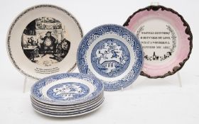A group of seven blue and white Guinness plates,