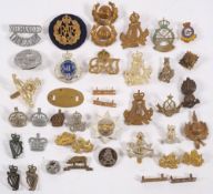 A collection of military cap badges: including, R.A.F.