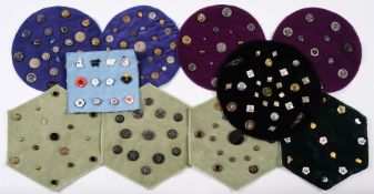 A collection of various buttons: mounted on ten mats.
