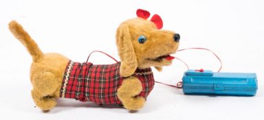 Yonezawa, a 1960's battery operated dachshund: with golden plush covered articulated body,