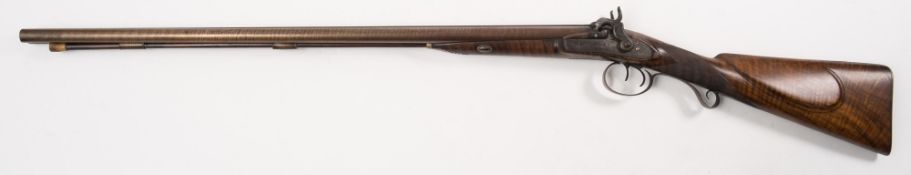 A double barrel percussion cap shotgun by D Long:, 30 inch Damascus barrels with engraved tang,