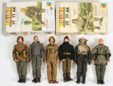 A group of eight 1/6th scale military figures in WWII German uniform,