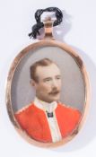 A late 19th century overpainted miniature portrait photograph of an officer:,