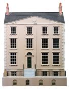 A Georgian style dolls house with double front opening enclosing seventeen rooms:,