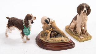 Border Fine Arts, a seated Springer Spaniel and a Terrier on a tree stump after Anne wall:,