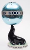 A Carlton Ware Guinness Sealion lamp with revolving shade:,