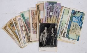 An accumulation of world banknotes: and a postcard of the Duke of Buckingham signed by Peter