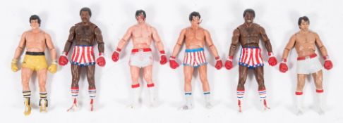 A group of six loose Neca 7 inch Rocky figures:,.