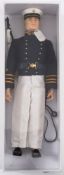 A Hasbro GI Joe painted head Marine:, with sword belt and sword, rifle and tag.
