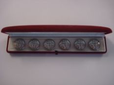 The Buckingham Collection of Buttons A set of six silver embossed circular buttons:,