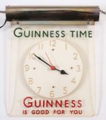 A Guinness wall clock:,