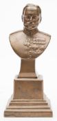 A bronze bust of Field Marshall Sir Douglas Haig: modelled in military uniform on a square socle