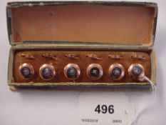 A set of six gilt metal dress studs: with mother of pearl and gilt stitched button centres,