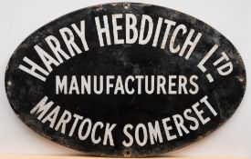 An early 20th century oval enamel sign for 'Harry Hebditch Lt Manufacturers Martock Somerset':,