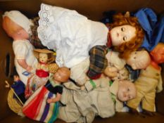 A collection of assorted celluloid, plastic and composition dolls,: various makers.