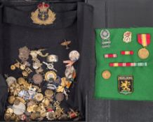 A collection of various enamel badges and other items:,