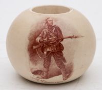 A James Macintyre pottery match holder: of globular form printed in sepia with 'A gentleman in