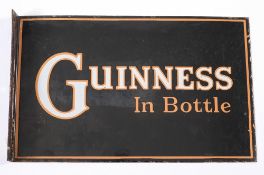 A rectangular double sided enamel shop sign 'Guinness In Bottle':,